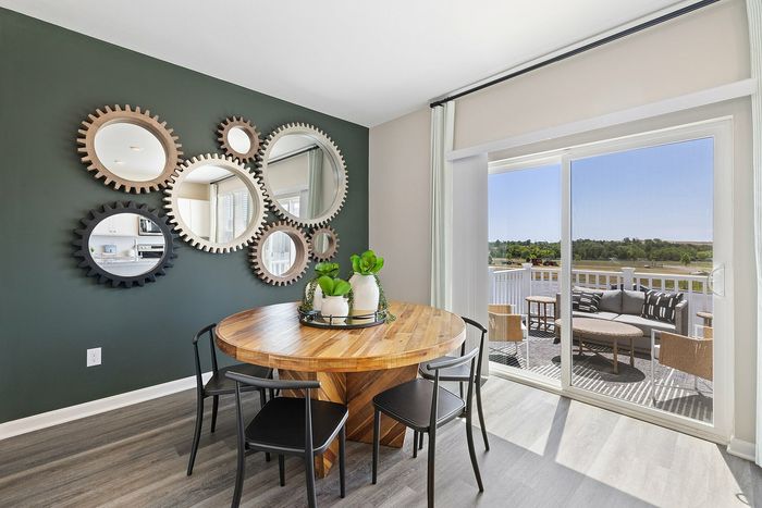 Furnished dining room wiht dining table and wall art