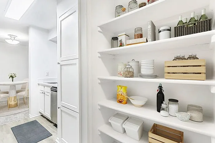 Shelving next to kitchen