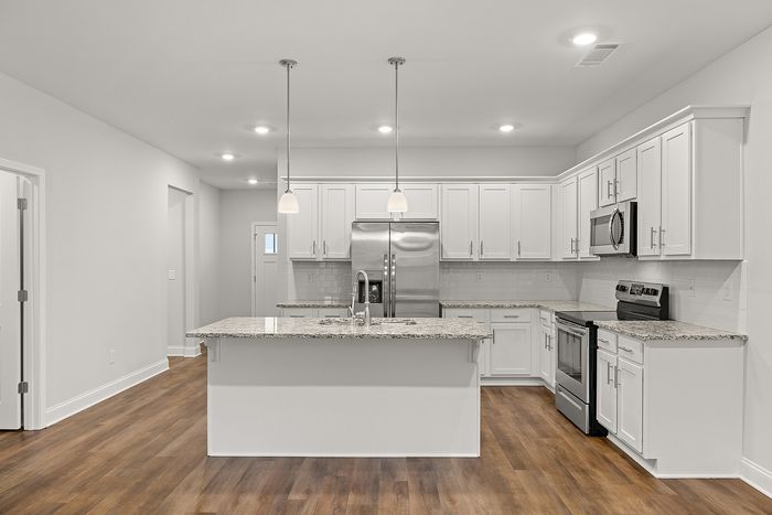 Chef inspired kitchen with white cabinets