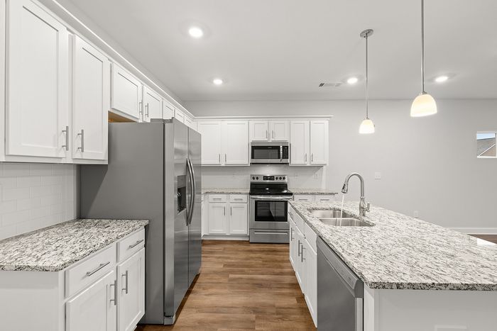 Chef inspired kitchen with white cabinets