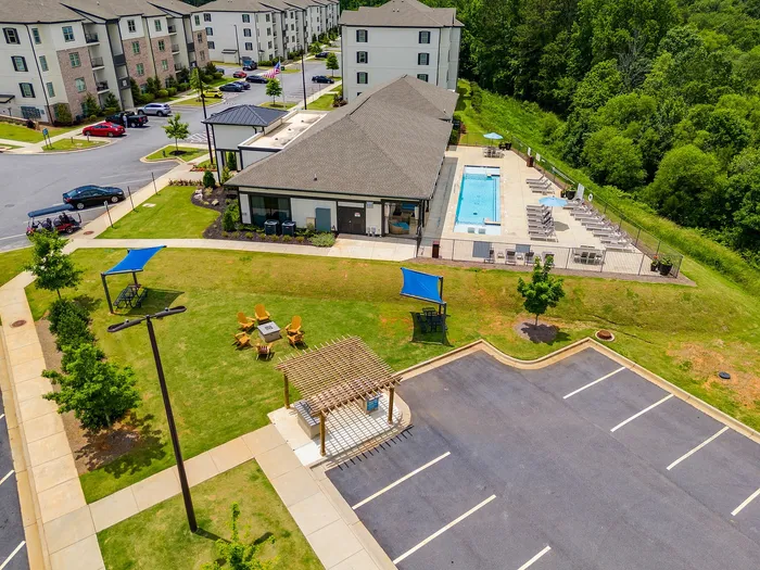 Birds eye view of the community clubroom and sparkling swimming pool at Paragon Luxury Apartments in Athens, GA