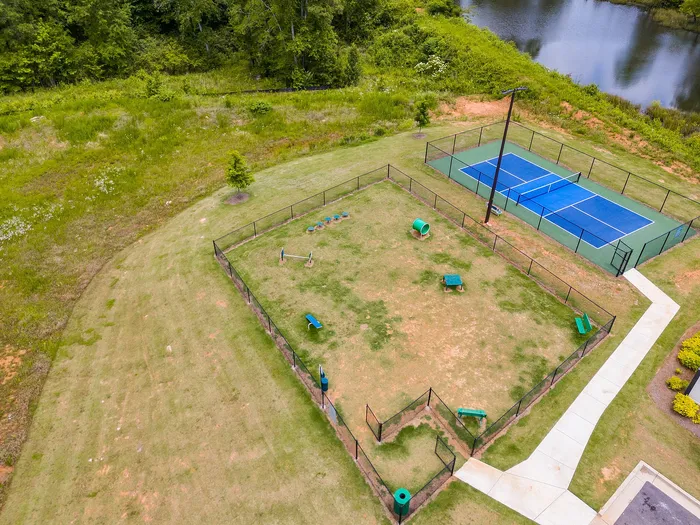 Birds eye view of the dog park and tennis courts at Paragon Luxury Apartments in Athens, GA