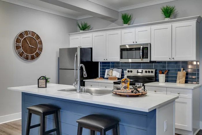 Chef-Inspired kitchen with blue and white cabinets at Paragon Luxury Apartments in Athens, GA