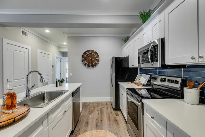 Chef-Inspired kitchen with blue and white cabinets at Paragon Luxury Apartments in Athens, GA