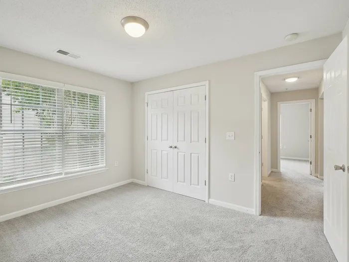 Bedroom with plush carpet