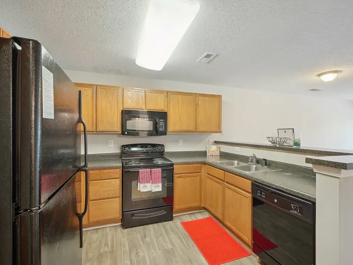 Kitchen with wood cabinets