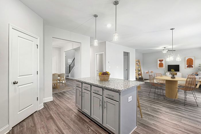 Virtually staged dining room with table and chairs