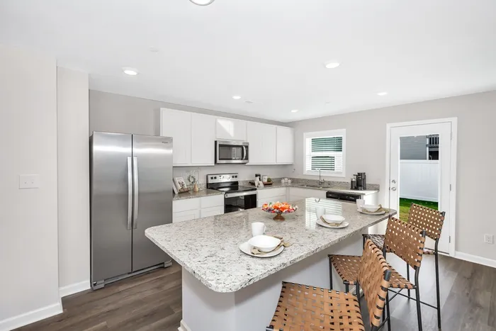 Kitchen with stainless steel appliances and island