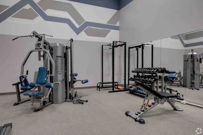 fitness center with free weights and machines