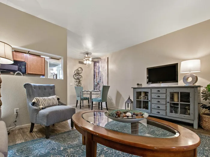 furnished living area adjacent to dining area
