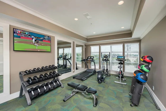 fitness center with free weights and cardio machines