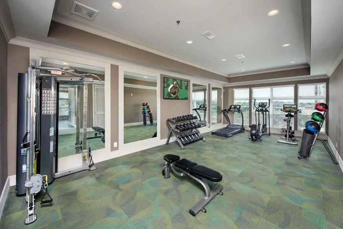 fitness center with free weights and cardio machines
