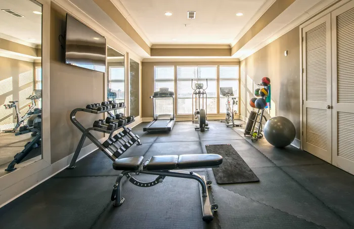 fitness center with free weights and cardio machines