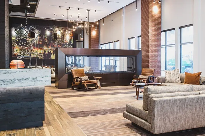 Clubroom with fire place, couches and chairs