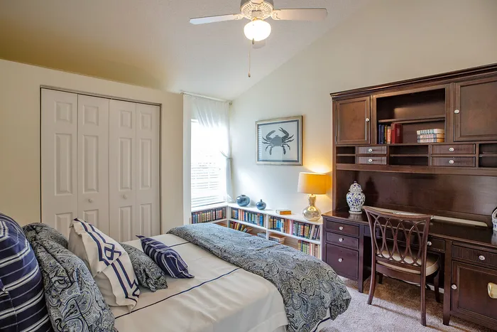 Bathroom with bed and desk