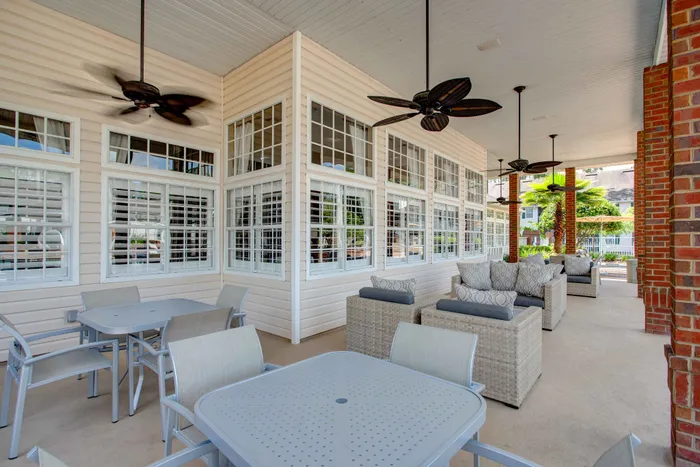 furnished pool patio covered with fans