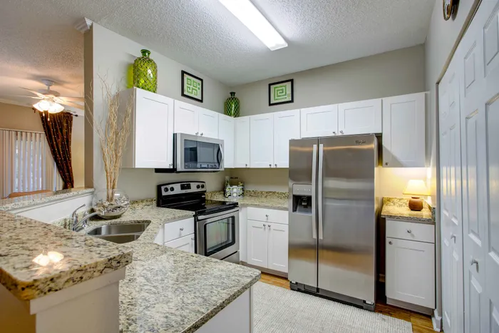 kitchen with white cabinets and stainless steel appliances