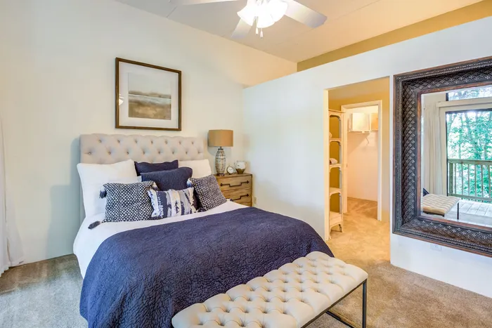 Spacious bedroom with carpet and high ceilings