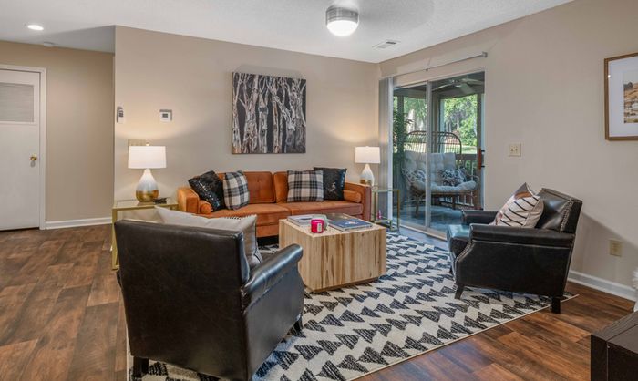 furnished living room with hardwood style flooring
