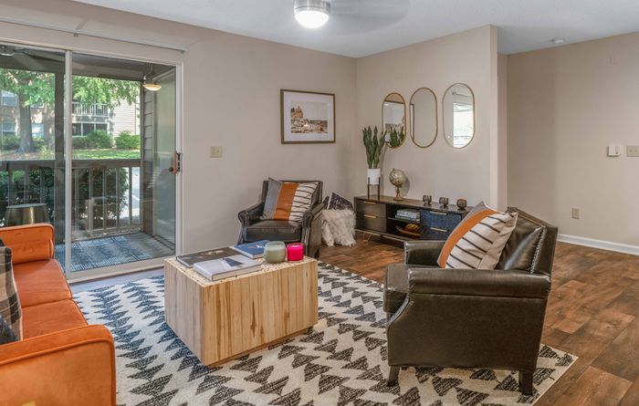 furnished living room with sliding glass door to patio