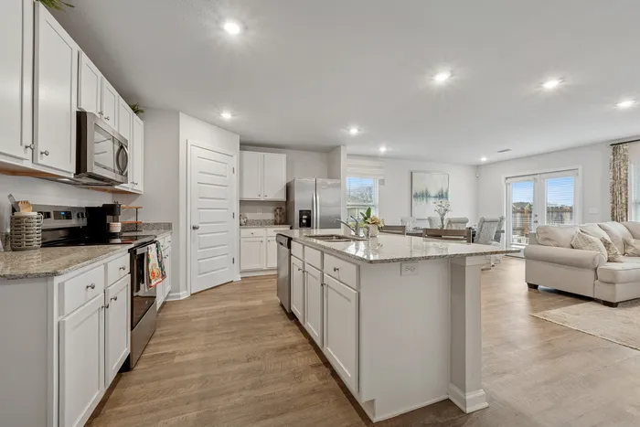 Furnished Living Area with Kitchen in background