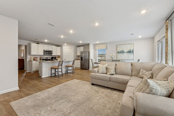 Furnished Dining Area with Kitchen in background