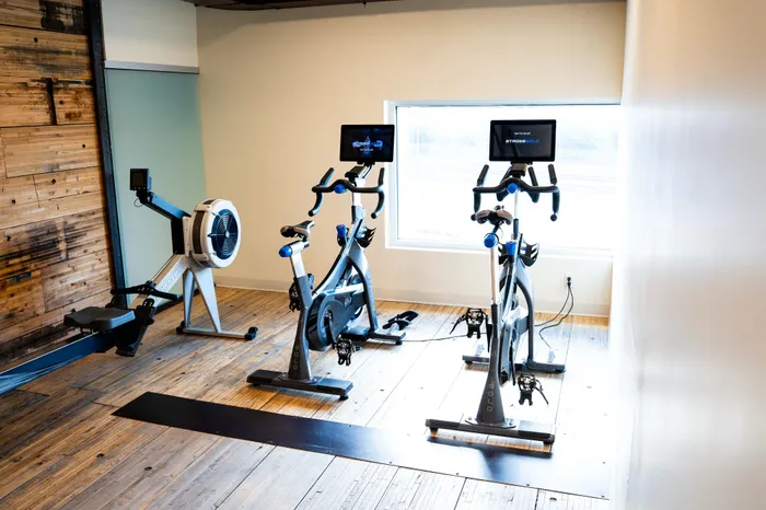 fitness center with bikes and rower