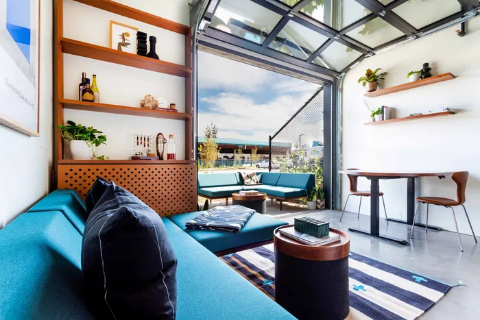 stylish living room with garage door to patio
