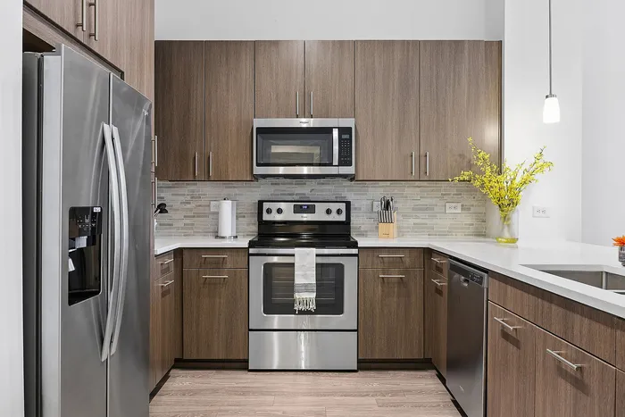 upgraded appliances and wood cabinets