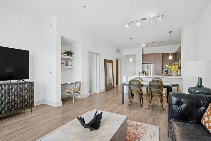 open-concept living room with built in desk