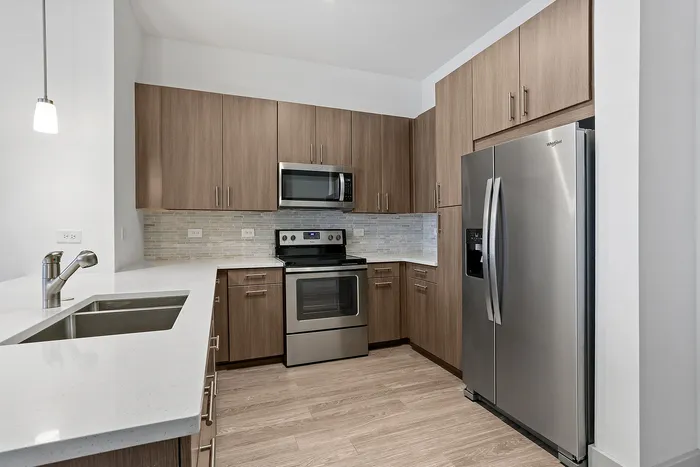 upgraded appliances with wood cabinetry