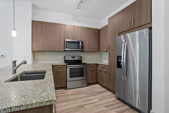 upgraded appliances with wood cabinetry