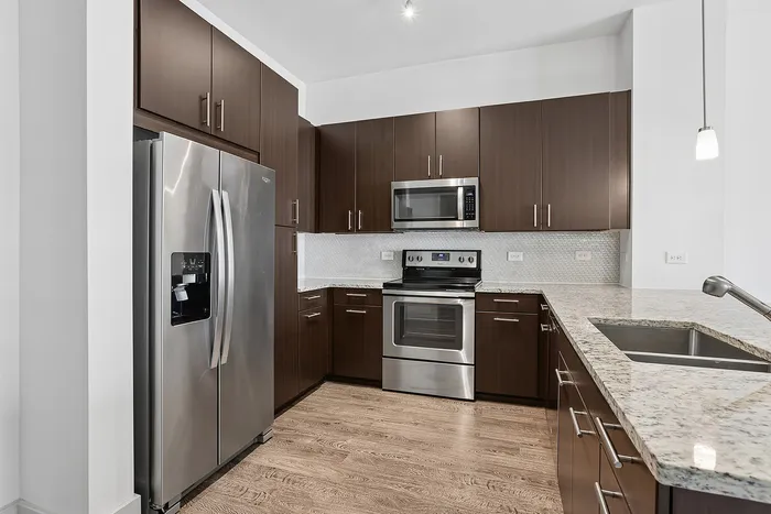 upgraded appliances with wood cabinetry