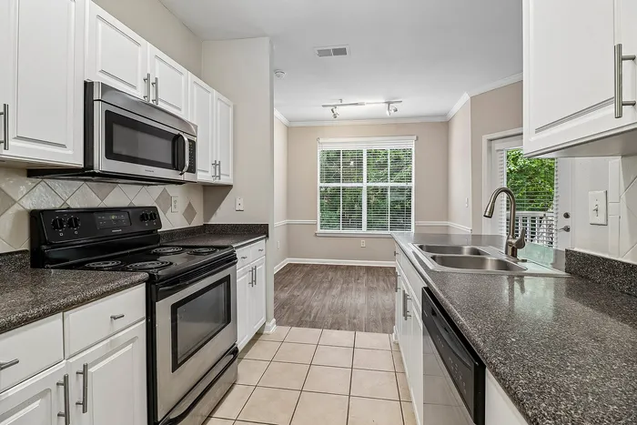 kitchen with stainless steel appliances and white cabinets