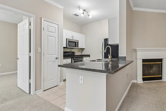 kitchen with stainless steel appliances and white cabinets