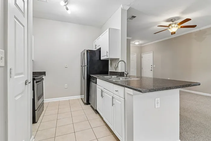 kitchen with stainless steel appliances and white cabinets