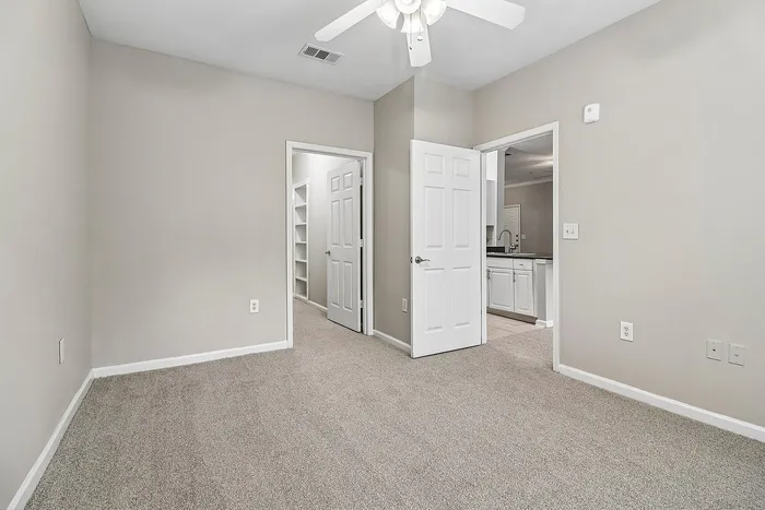 carpeted bedrooms with ceiling fan