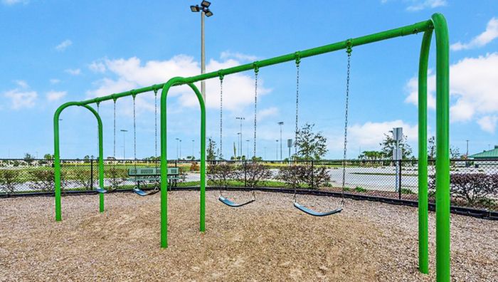 playground swings in daytime