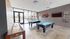 Game lounge area with shuffleboard and billiards