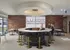 Stylish lounge with a circular bar, black stools, and