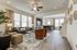 furnisedh living, dining and kitchen area of townhome