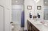 furnished bathroom with shower in townhome