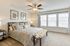 furnished bedroom with ceiling fan in townhome