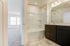 unfurnished bathroom with shower in townhome