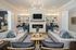 furnished clubroom area with seating and fireplace