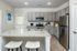 furnished kitchen with island of home