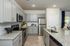 furnished kitchen with island of home