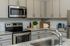 furnished kitchen with island of home