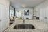 furnished kitchen with island of home