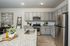 furnished kitchen with island in home